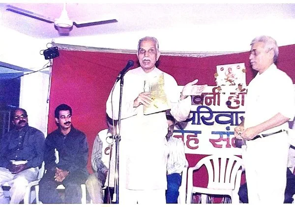 Appa Samantji speaking on stage